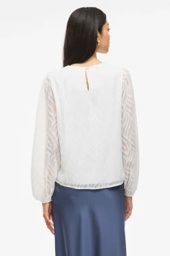 Blusa manga larga con cuello redondo