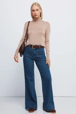 Jersey cuello alto botones pu&ntilde;os